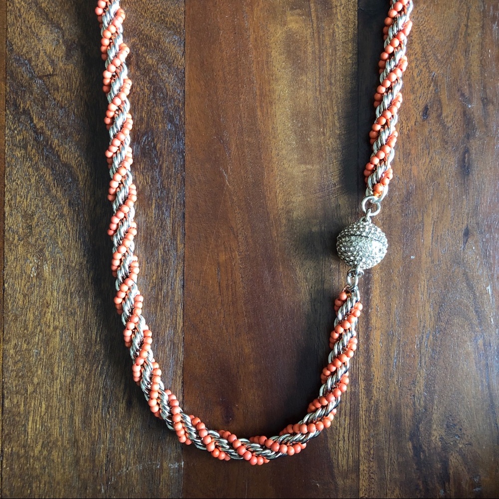 Gold statement necklace with orange beaded detail